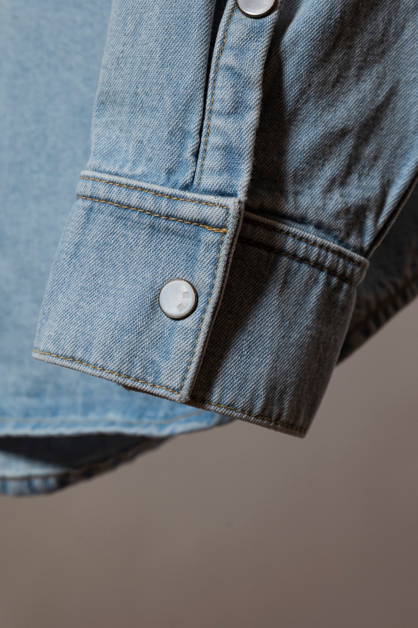pearl buttons on denim mens shirt