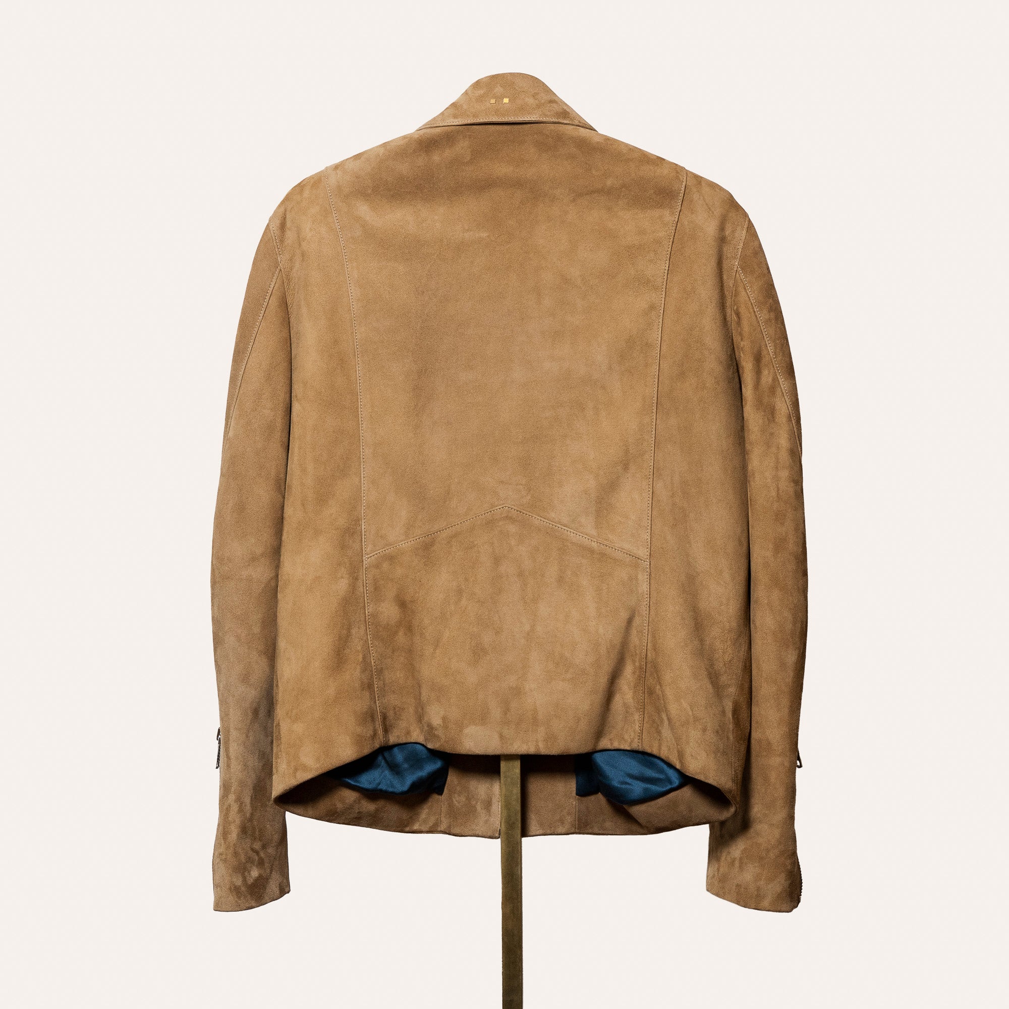 Classic Brown Suede Zip-Up Jacket. Lightweight calf suede jacket with a soft, malleable texture, tailored for comfort and durability.