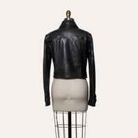 Black leather jacket on a mannequin against a white background