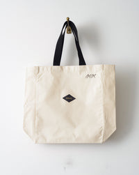 large canvas tote bag with black handle for beach or everyday designed by atelier savas in nashville tennessee for men and women