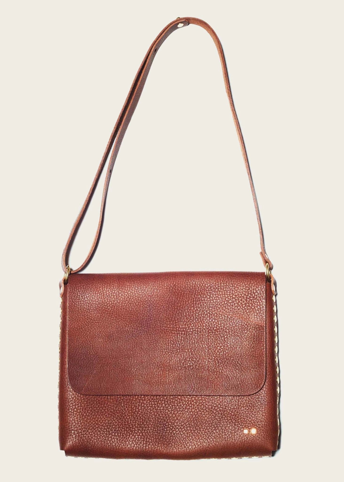 brown leather crossbody bag with handmade western wear details for men and women gift guide
