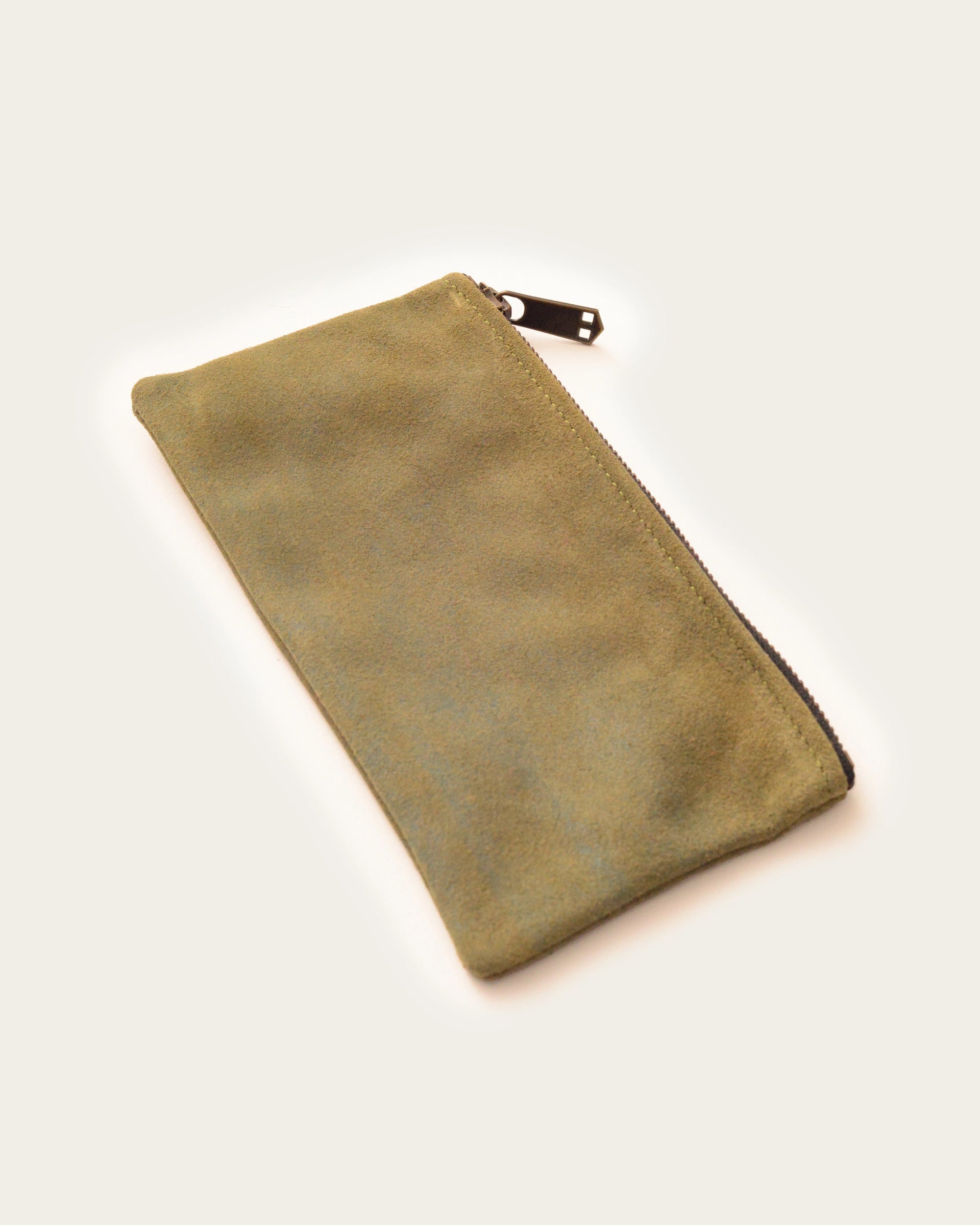 luxury leather clutch in green artisan-made by atelier savas in nashville tennessee for men and women gifts