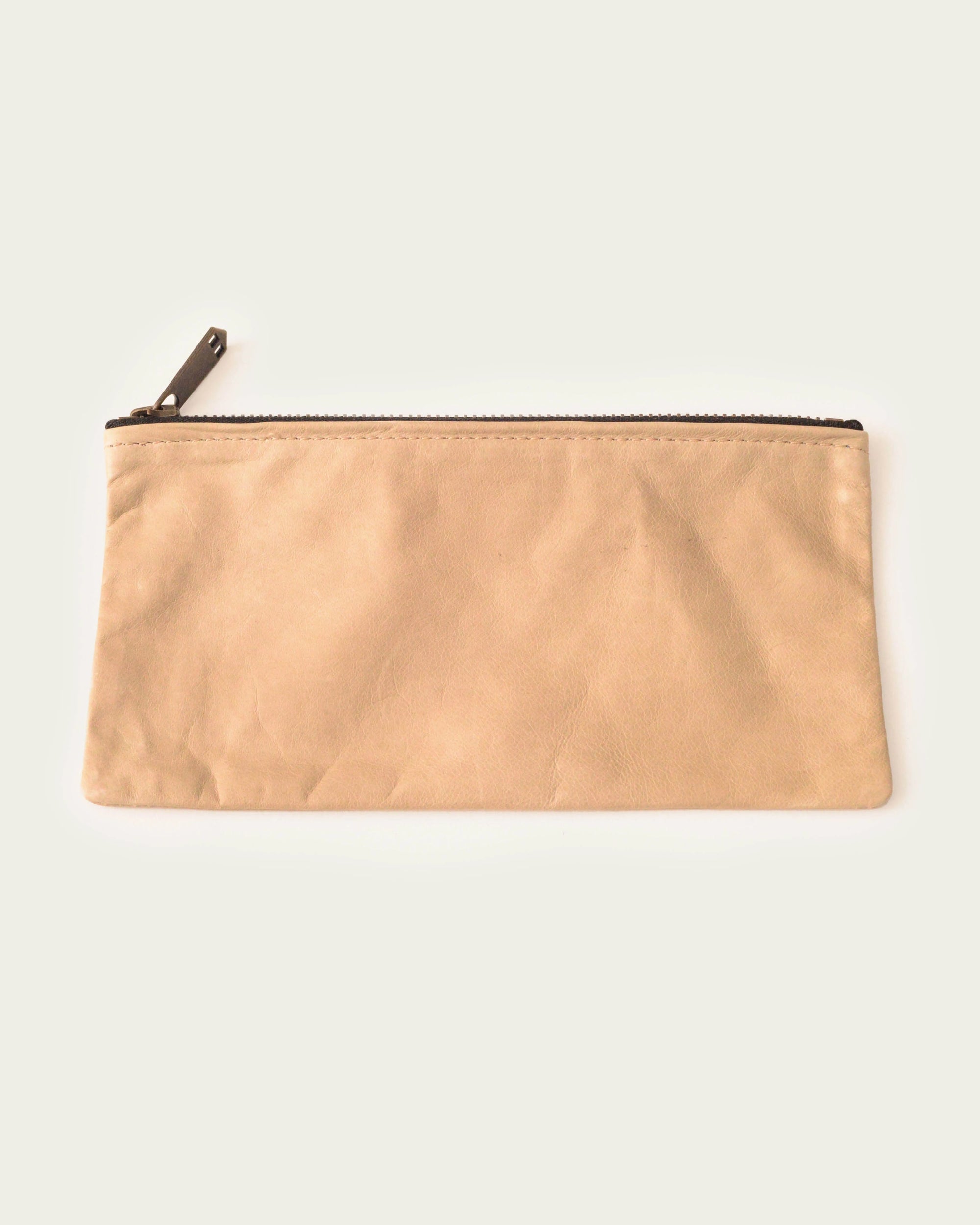 artisan-made leather clutch in tan by luxury brand atelier savas in nashville tennessee