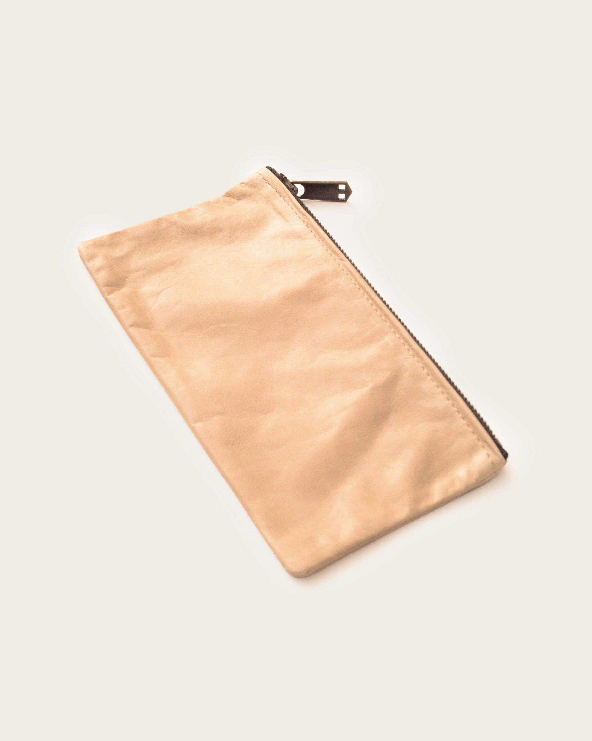 women's leather clutch in tan with handmade details and artisan-made seams from atelier savas
