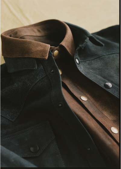 Close-up of two Savas jackets laid on top of each other.