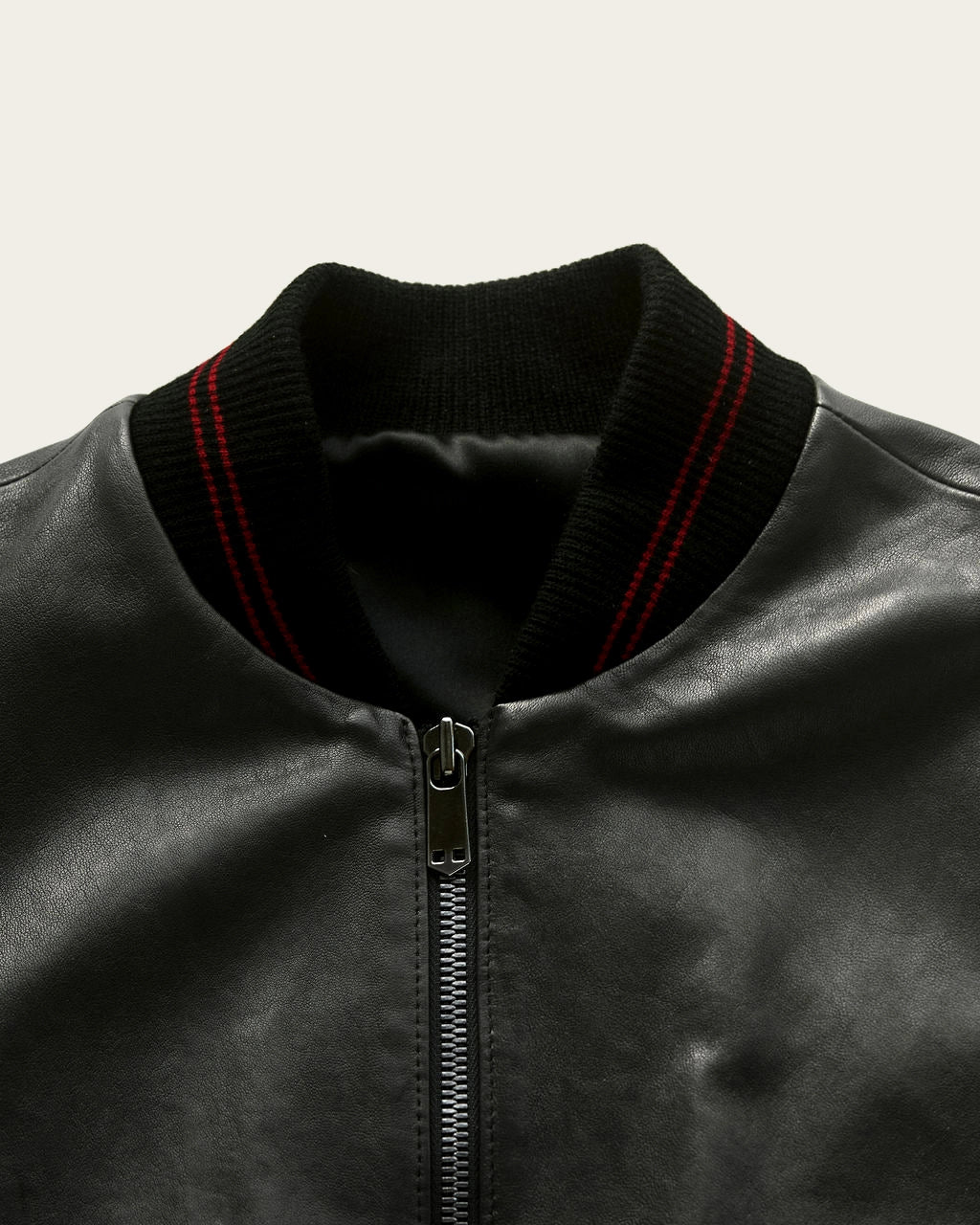 artisan-made black leather jacket with brass details by savas in nashville tennessee