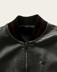 artisan-made black leather jacket with brass details by savas in nashville tennessee