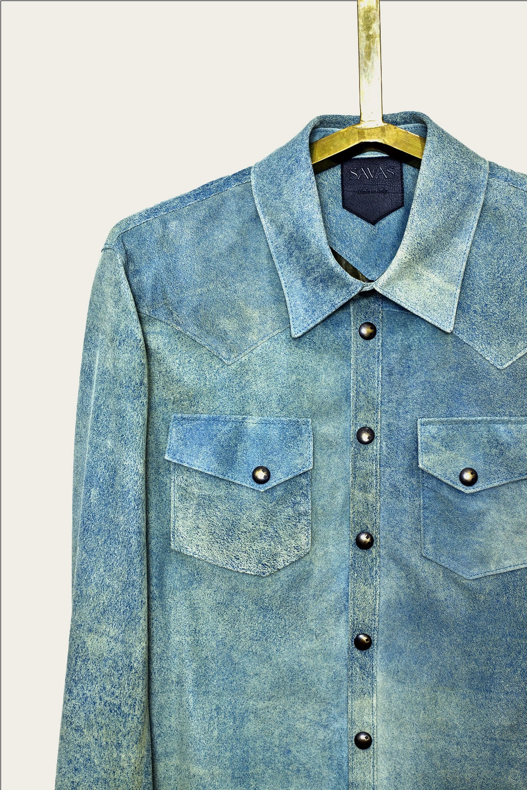 collar and pocket detail of mens luxury shirt jacket in indigo blue genuine leather with handmade snaps by luxury menswear designer savas in nashville tennessee