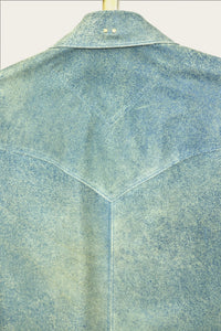 close up of mens luxury shirt jacket in indigo blue genuine leather with handmade snaps by luxury menswear designer savas in nashville tennessee