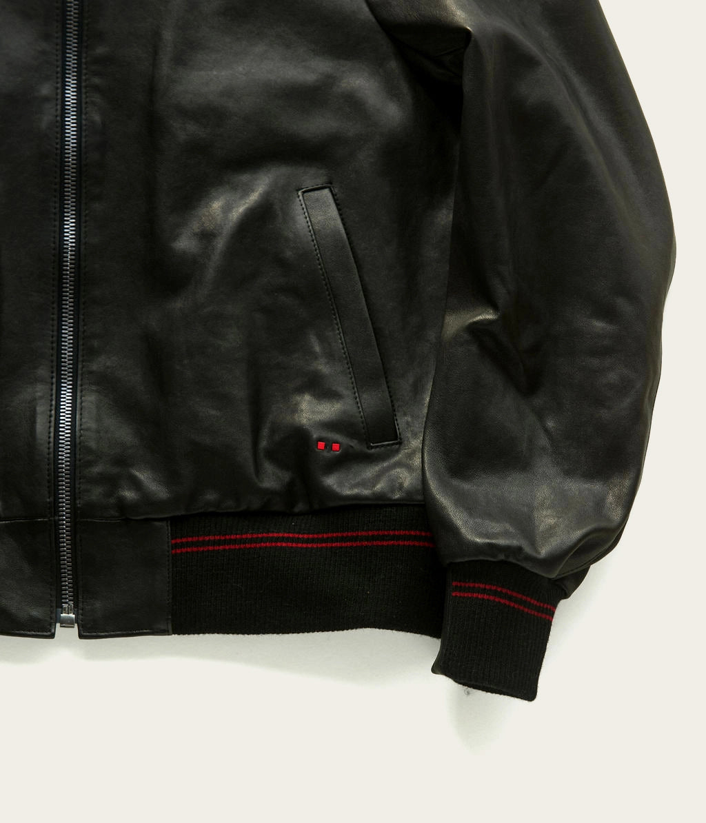 artisan-made genuine leather jacket in black with red detail by savas in nashville tennessee