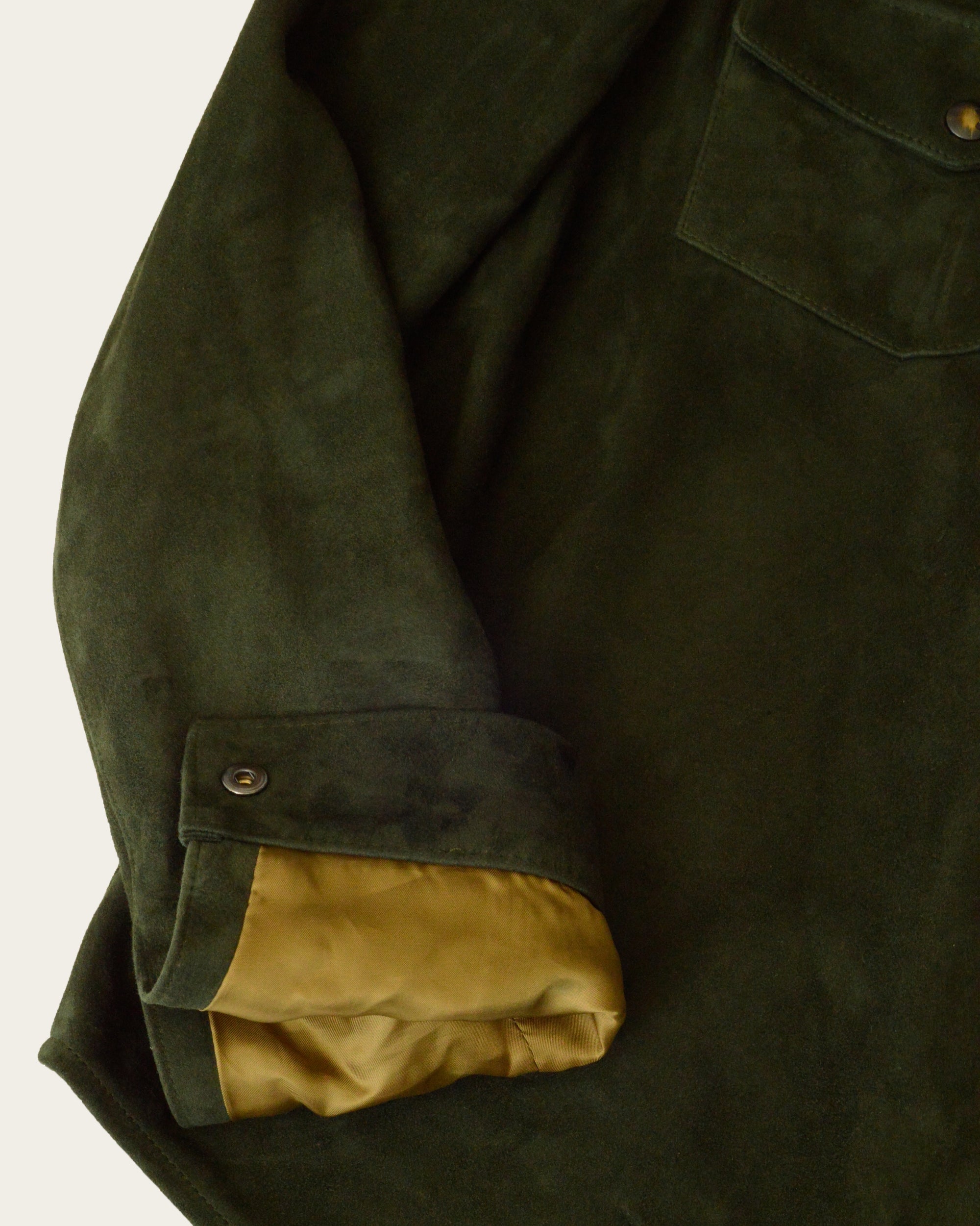 artisan-made shirt jacket in hunter green suede with custom details by savas in nashville tennessee