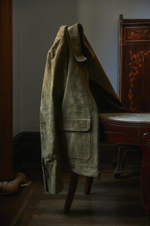 Image of Savas jacket resting on a chair.