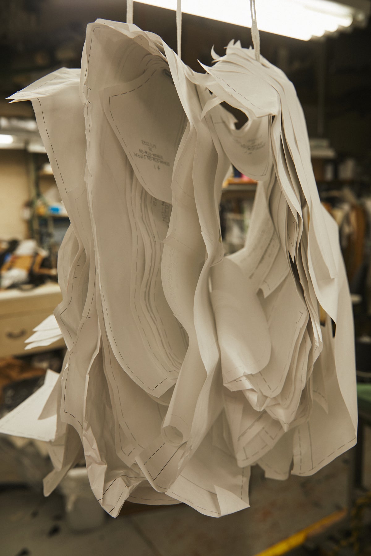 Image of paper pattern pieces on a hanger.