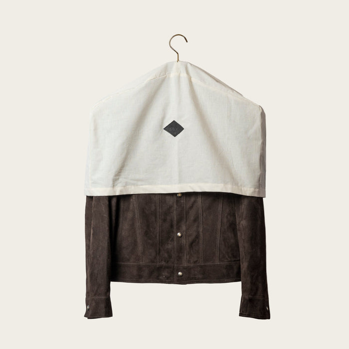 Black hanger on a beige fabric background collector sets
