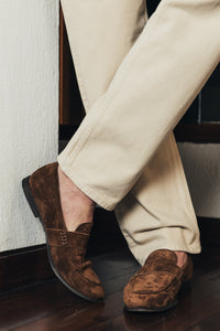 Model wears The Coyle suede loafer in Cedar brown. Made in Italy. Designed by Savas. 