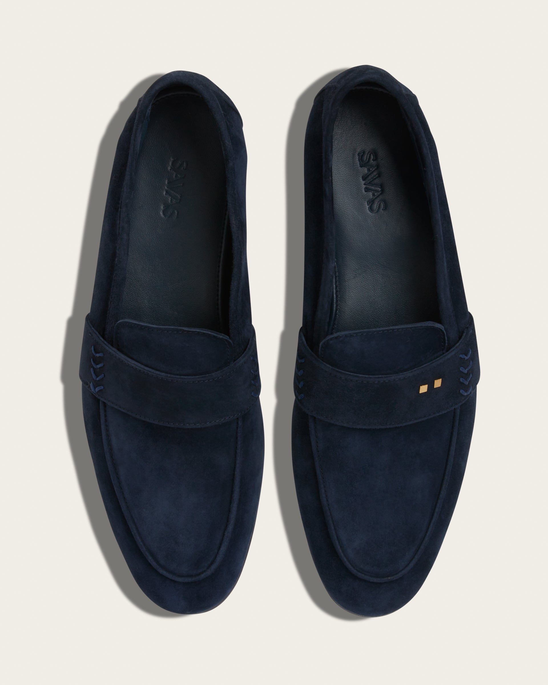Top view of The Coyle loafers in sapphire Italian calf suede, Two Dots signature brass rivets centered at vamp