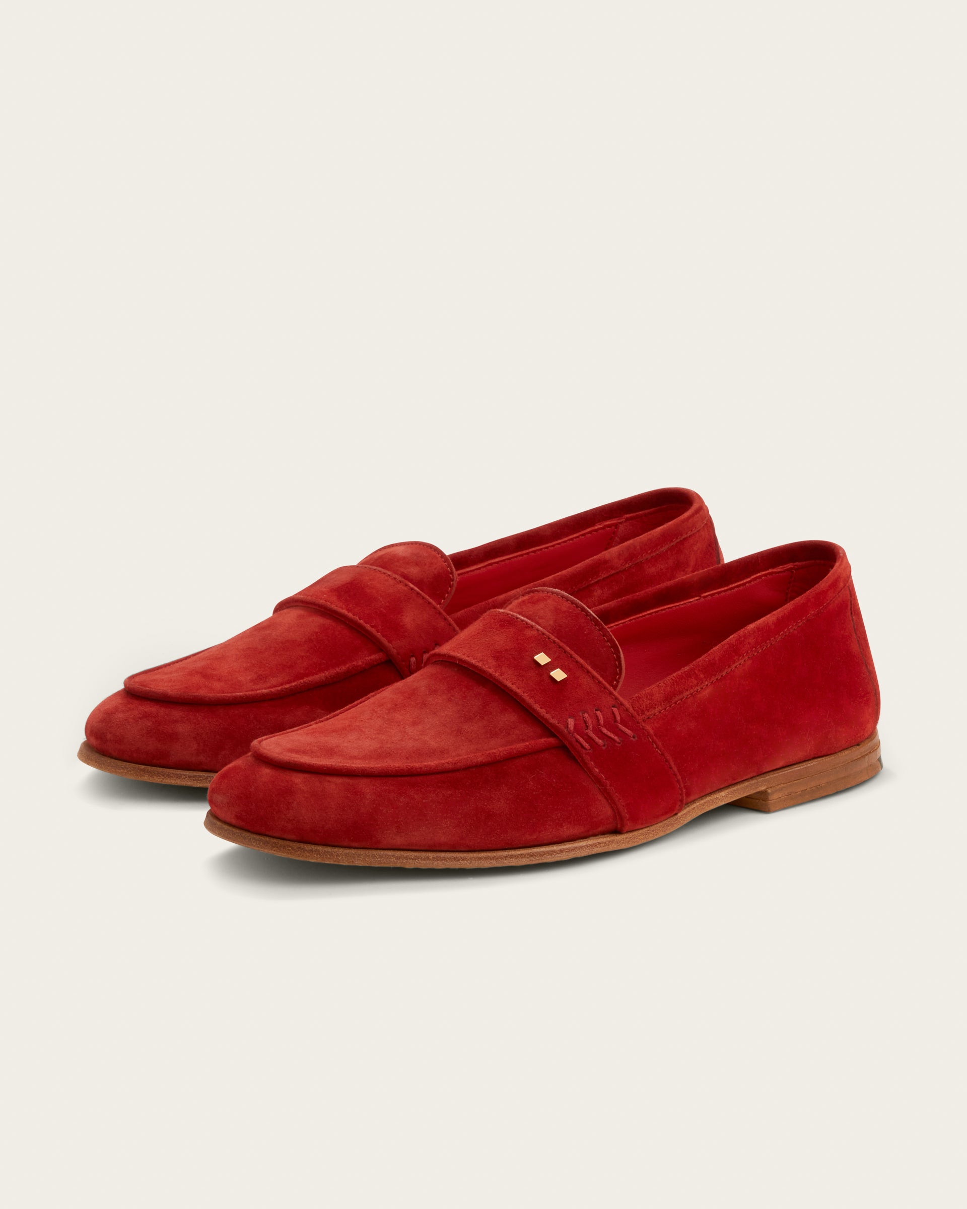 The Coyle loafer in saffron Italian calf suede, three-quarter angle showing napped finish and Bologna construction