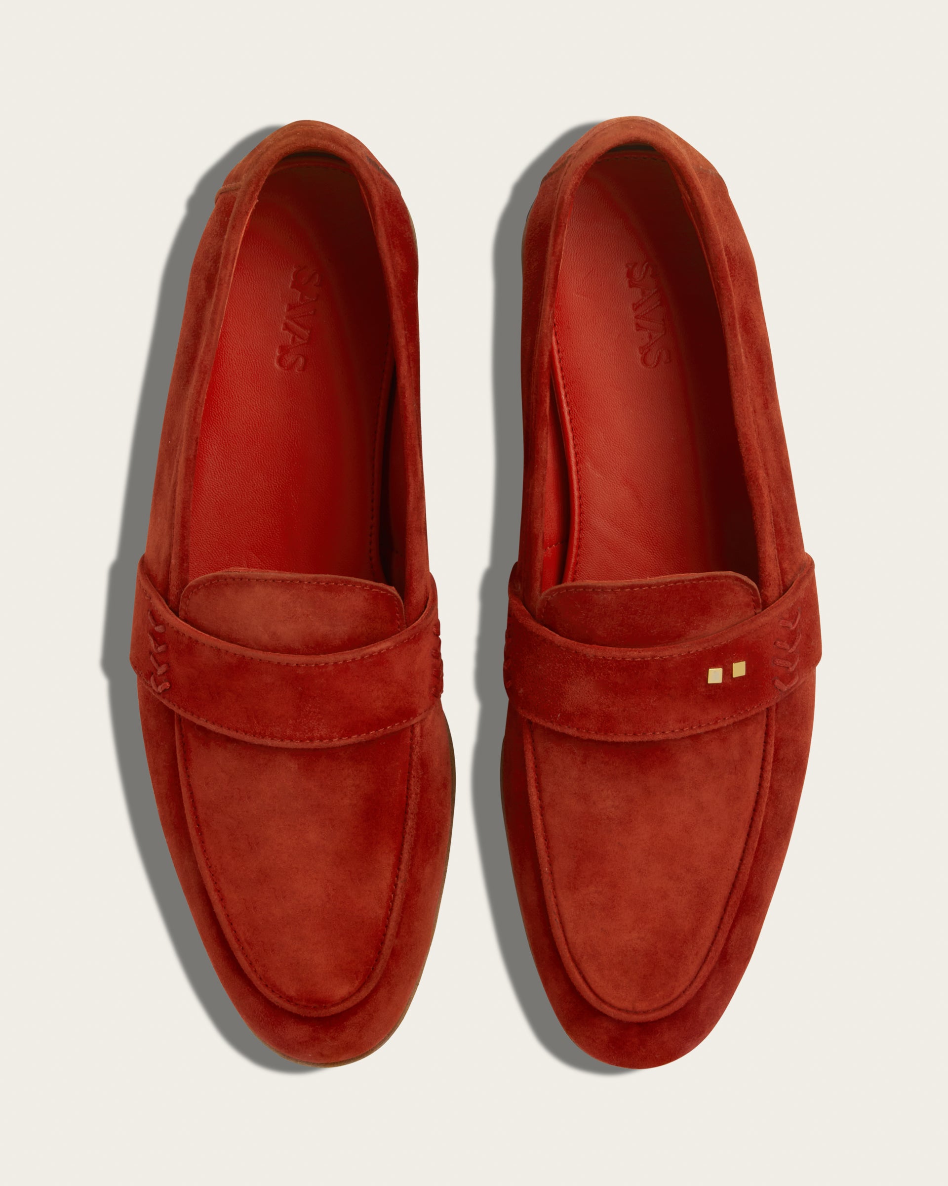 Top view of The Coyle loafers in saffron suede, Two Dots signature brass rivets centered at vamp