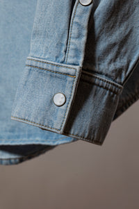 pearl buttons on denim mens shirt