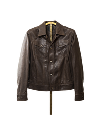 A softly tailored brown lamb leather jacket with a clean, versatile silhouette, gunmetal hardware, and smooth lining. Designed for everyday wear, adaptable from casual to refined styling.