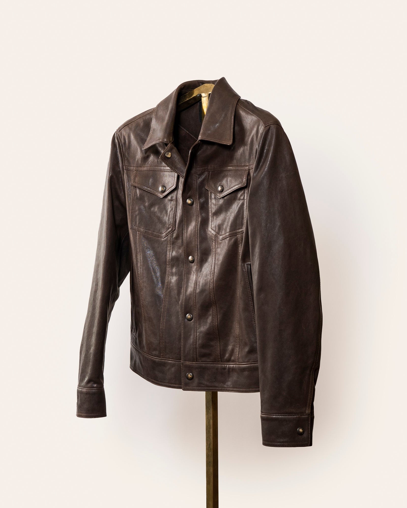 The Denham jacket by Savas in 100% lamb leather with gunmetal logo hardware, softly tailored fit, and Bemberg lining. A versatile black leather jacket that styles effortlessly with jeans or trousers.
