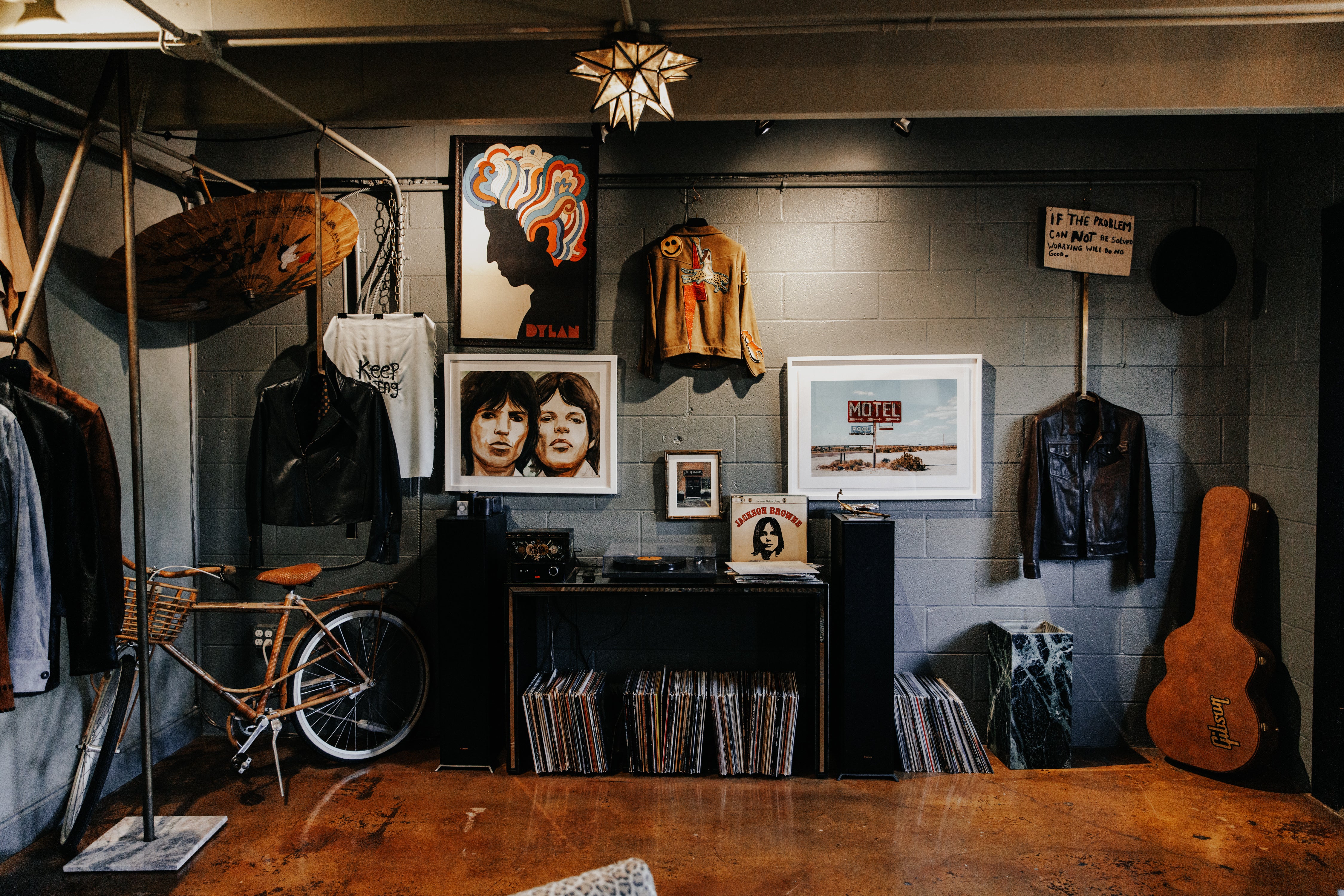 SAVAS NASHVILLE STORE ENTRANCE wall of records and artwork, vintage bicycle and guitars