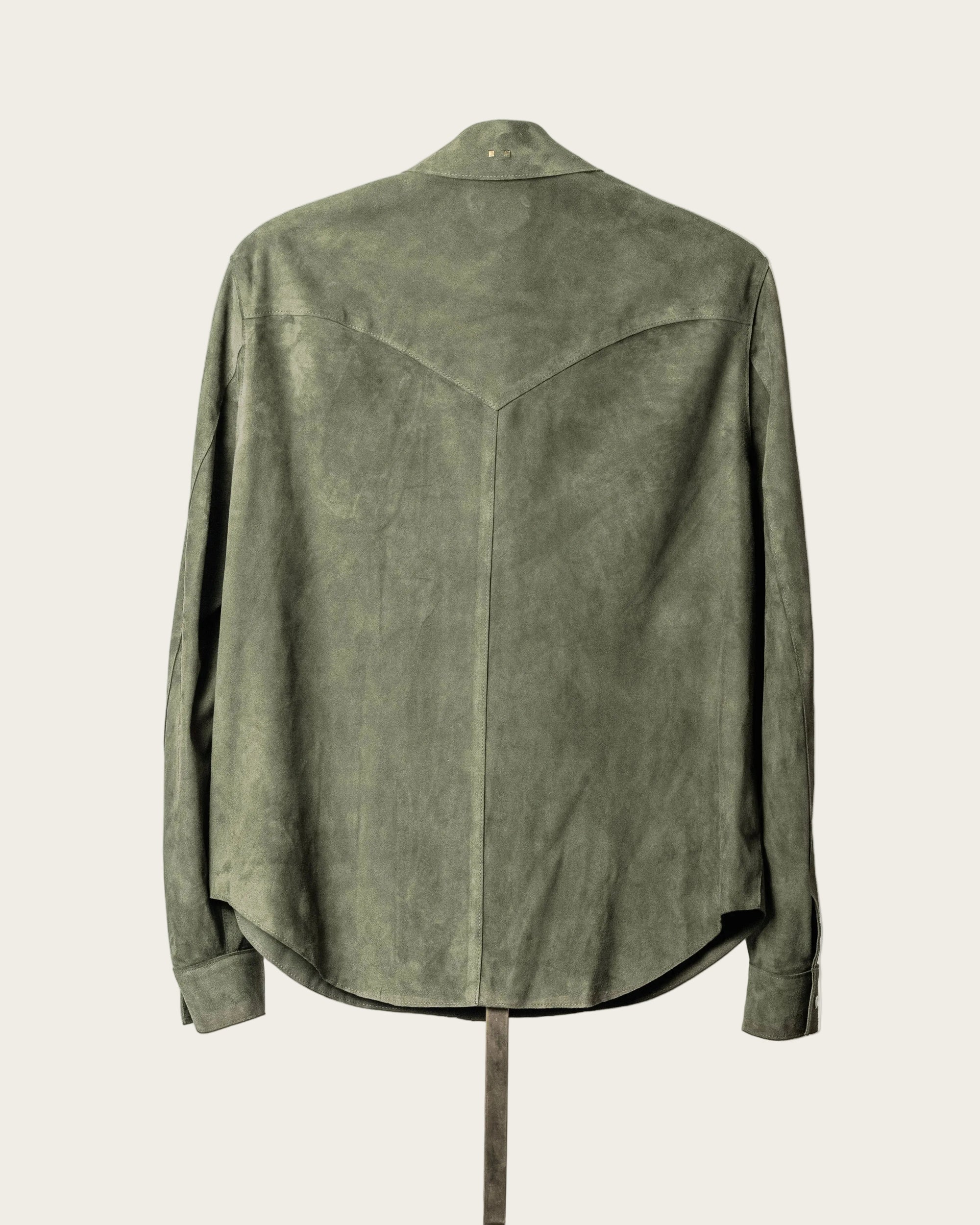Green suede jacket on a white background