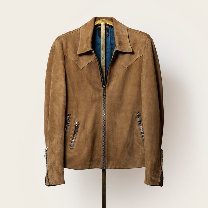 Suede jacket featuring three exterior zip pockets, adjustable sleeve gussets, and a clean, minimalist cut.