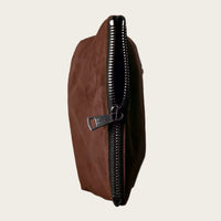 Brown leather pouch with a zipper on a beige background