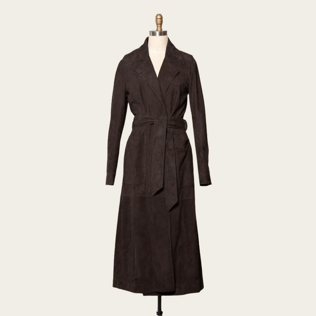 Dark brown Italian suede Shelby Duster, a long belted coat with notch lapels, shown on a dress form by Atelier Savas