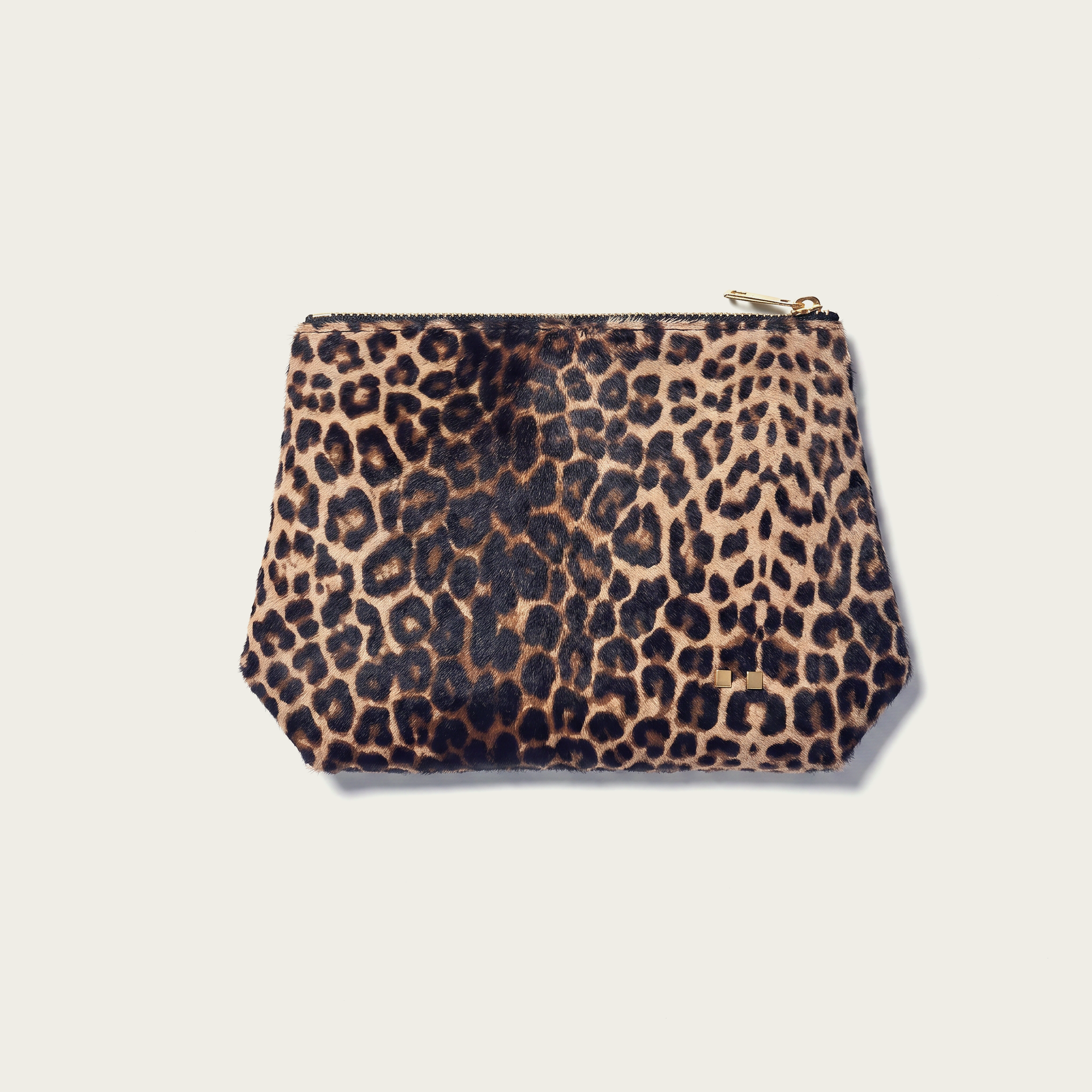 Leopard print pouch on a beige background