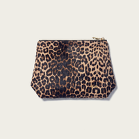 Leopard print pouch on a beige background