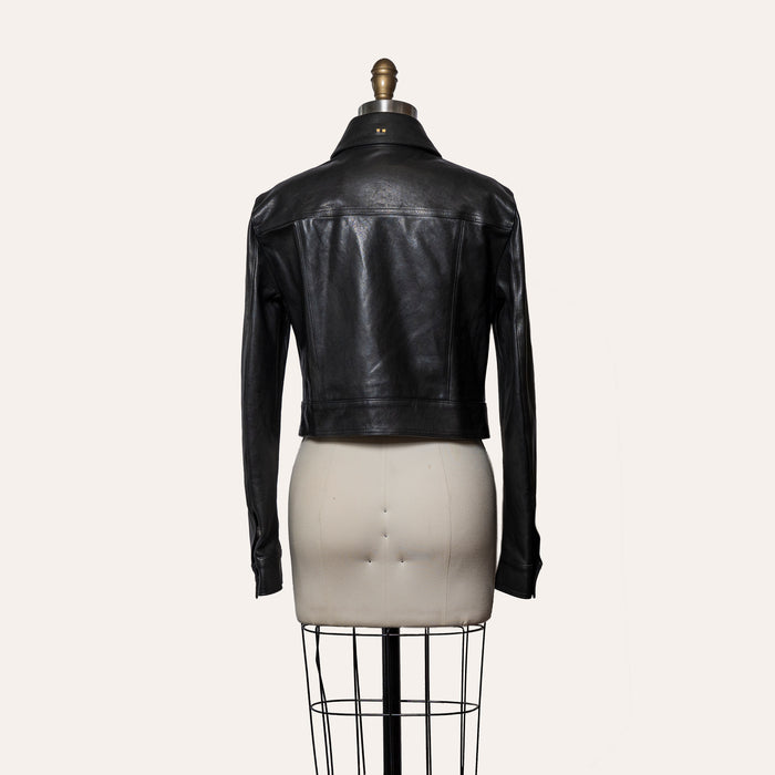 Black leather jacket on a mannequin against a white background