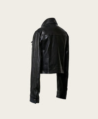 Black leather jacket on a light beige background