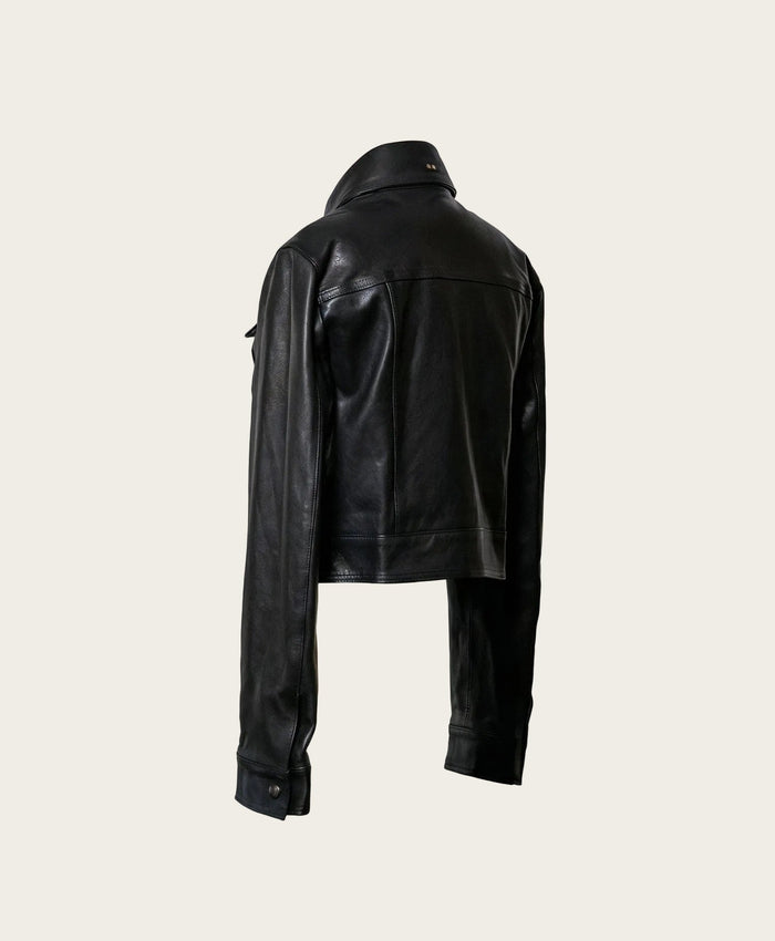 Black leather jacket on a light beige background