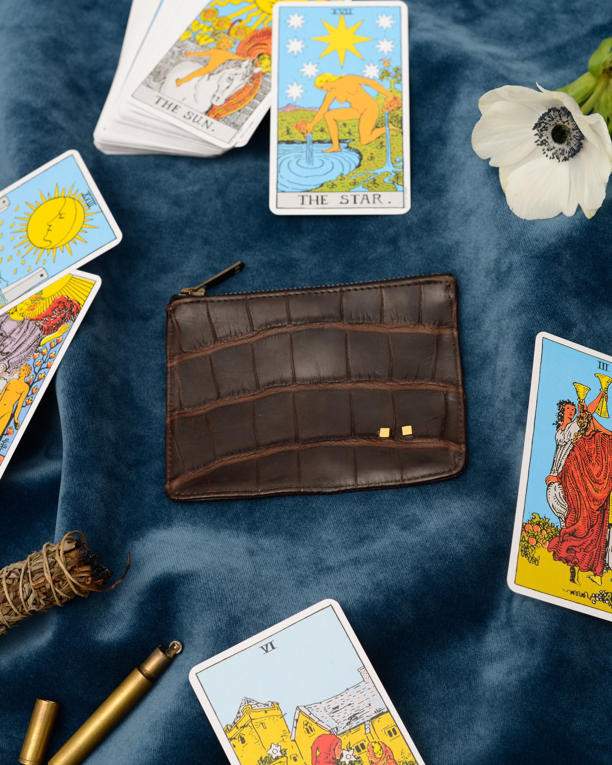 alligator pouch styled with cards for atelier savas luxury apparel in nashville tennessee