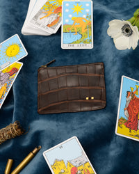 alligator pouch styled with cards for atelier savas luxury apparel in nashville tennessee