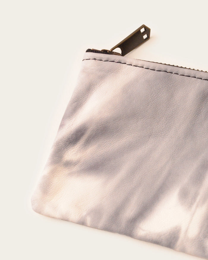 handmade leather clutch in tie dye print by luxury western wear brand atelier savas in nashville tennessee