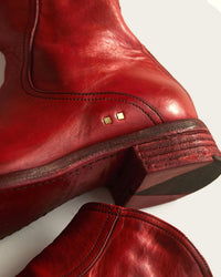 handmade brass details on genuine italian leather mens boot in red by luxury designer atelier savas in nashville tennessee