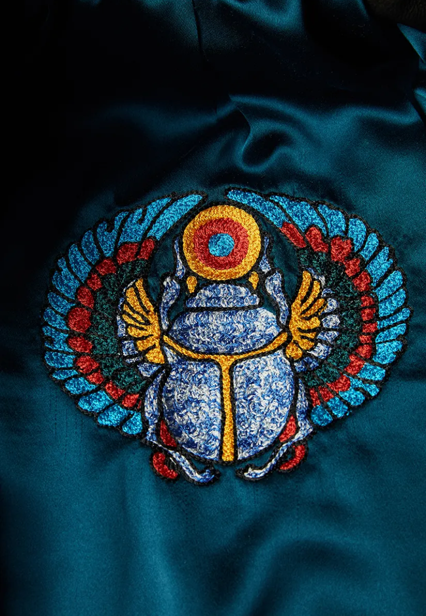Example of multicolored Scarab embroidery on a Savas jacket lining.