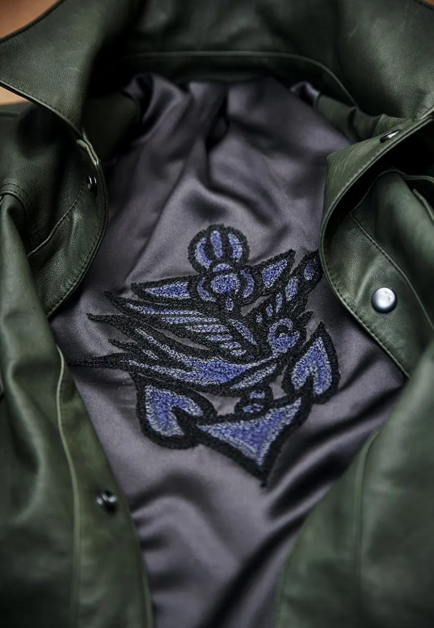 Example of multicolored Bird & Anchor embroidery on a Savas jacket lining.