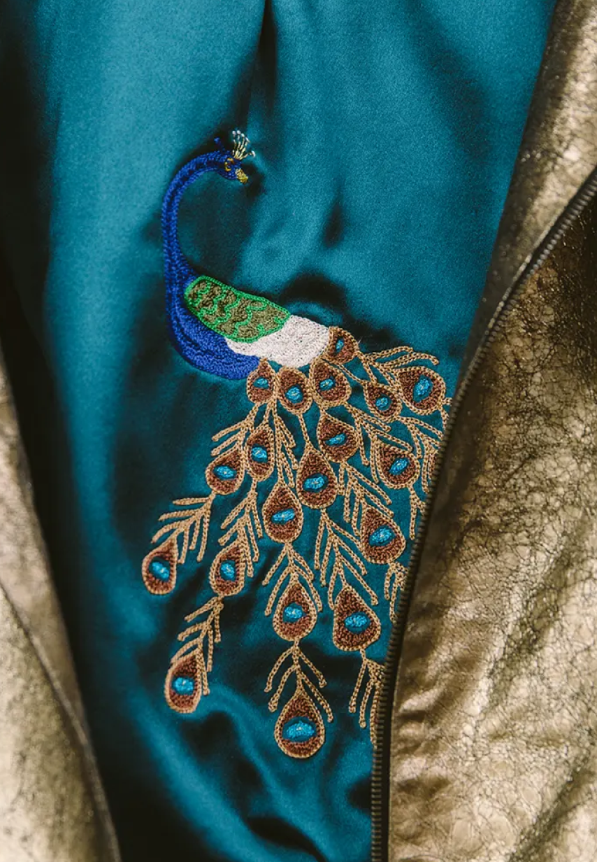 Example of multicolored peacock embroidery on a Savas jacket lining.