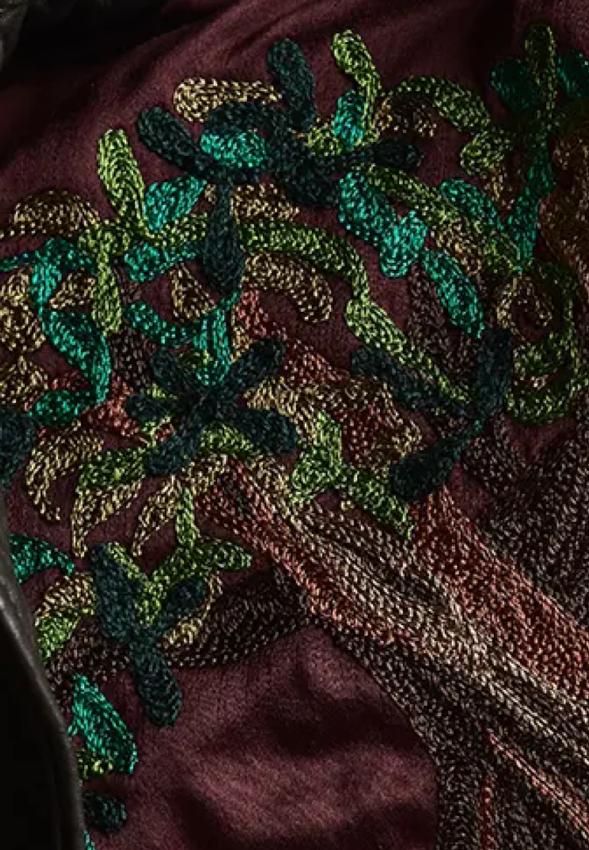 Example of multicolored tree embroidery on a Savas jacket lining.